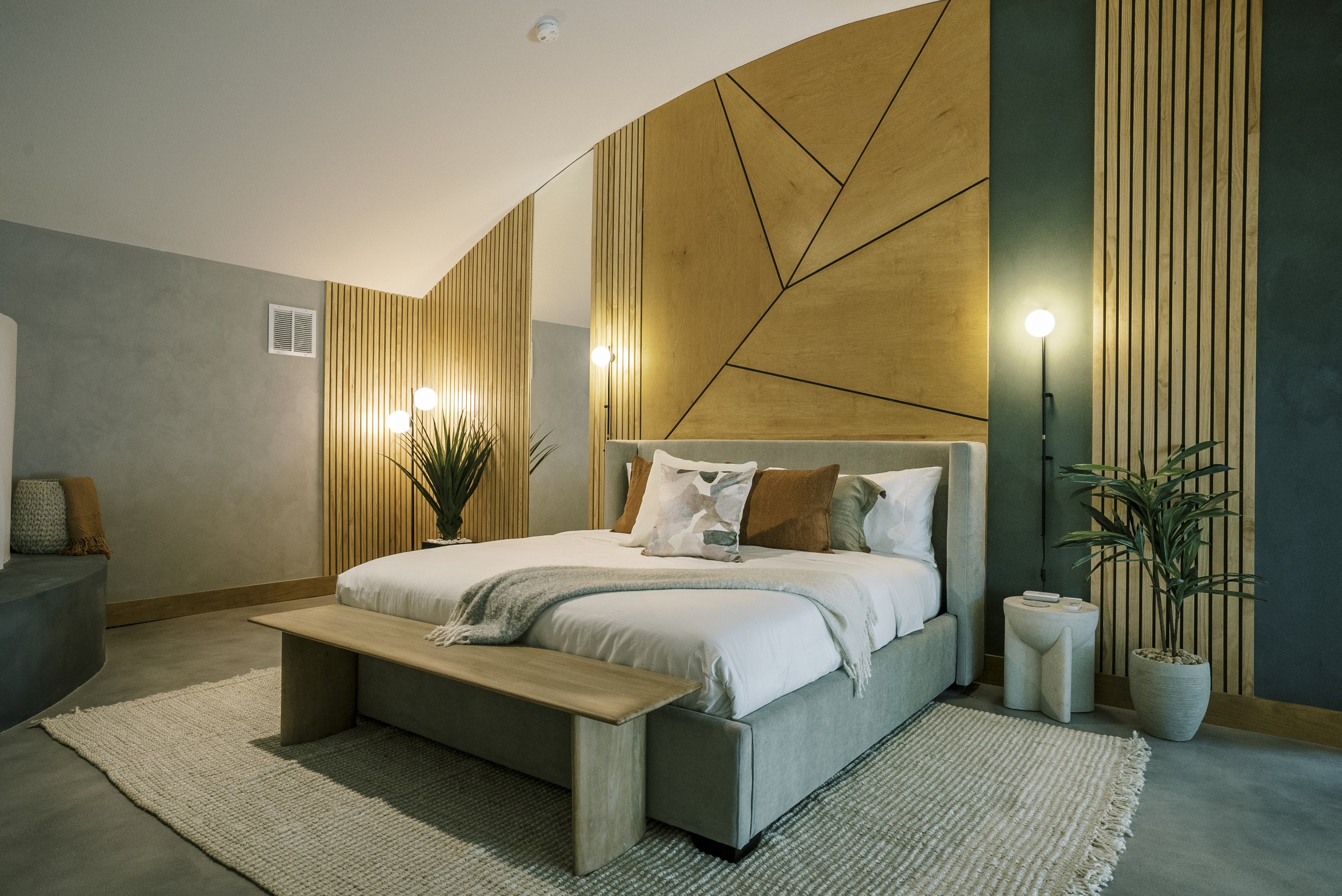 Serene primary suite with vaulted ceiling — real estate photography by Texas Homes Media, Central Texas